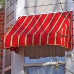 Small Red Awning with Yellow Strips
